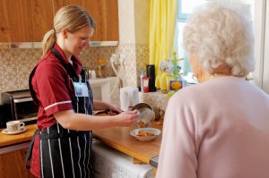 Home Health Caregiver assist with meal preparation